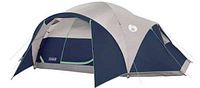 Angled front view of navy and gray tent with green trim and extended door awning