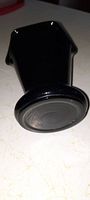 Bottom view of heavy black amethyst glass vase showing thick glass base and shape.