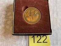 Front side of the bronze 200th Anniversary United States Constitution medal showing portraits of Gouverneur Morris and James Madison with the Independence Hall clock tower in background, housed in burgundy/red velvet-lined box