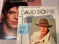 Photo showing the 'Changes Two' album cover featuring David Bowie's portrait and the 'David Bowie' book from The Anabas Look Book Series with a cover photo of Bowie in a coat and hat.