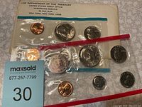 Photo showing the front side of the 1972 uncirculated coin set in original transparent plastic with paper backing and Treasury Department label