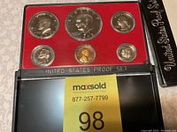 Full view of the 1973 S United States Proof Set inside the original plastic case with red velvet interior and black holder labeled 'United States Proof Set', showing all six proof coins.