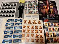 All five sheets visible showing various stamp themes including Apollo 1975, teddy bears, baseball, Star Wars, and Black Cinema.