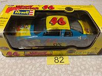 Image showing boxed Woody Woodpecker 46 diecast car by Revell in original packaging with clear viewing window.