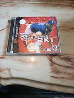 Front view of Sega Dreamcast World Series Baseball 2K1 game in jewel case on marble surface.