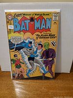 Front cover of Batman Comic Book Issue #160 showing Batman, Robin, and an alien character with visible wear and protective sleeve.