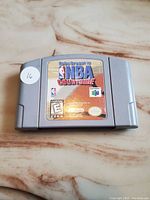 Front view of grey Nintendo 64 NBA Courtside game cartridge with official label