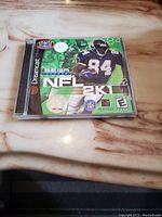 Front cover of the NFL 2K1 Sega Dreamcast game showing player and game title.