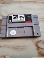 Front view of the NHL 94 SNES cartridge showing the main label with game title and branding.