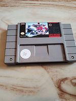 Front of the NHL Stanley Cup Super Nintendo game cartridge showing the label with the game title and hockey design.