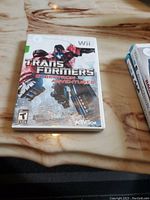 Front cover of the Transformers Cybertron Adventures game for the Nintendo Wii, showing artwork and title.