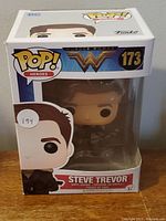 Front view of Steve Trevor Funko Pop figure in original box, showing clear window and figure inside.