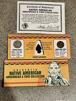 Photo of the Certificate of Authenticity and overall display box with arrowhead and two coins