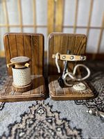 Front angle showing both nautical-themed wooden bookends with rope and anchor details.