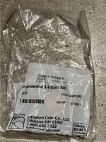 Photo of sealed packaging with label stating 'Presidential $4 Coin Set 2012 Uncirculated-60', Littleton Coin Co. NH contact