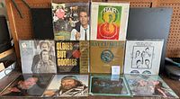 Photo of 12 vintage vinyl album covers, including Ray Charles, Hair soundtrack, Kenny Rogers, Hank Ballard & The Midnights, Oldies But Goodies, showing condition and variety in the lot.