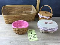 Four Longaberger baskets together showing various shapes and sizes with fabric liners and lids.