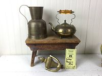 Front view of all four items displayed together on and near the wooden stool