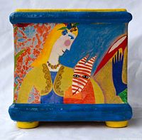 Photo of planter side featuring a woman with yellow hair and a figure in red and white striped clothing against a blue background with thick blue top and bottom edges