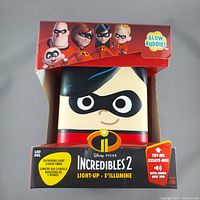 Front view of the Glow Buddies Incredibles 2 character light in original packaging showing character face and Incredibles branding