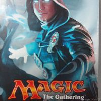 Close-up of Magic: The Gathering box front with hooded mage illustration