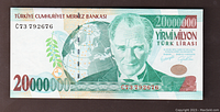 Front side of the 20,000,000 Turkish Lira banknote showing the portrait of Mustafa Kemal Atatürk with globe illustration and denomination.