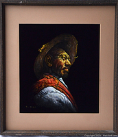 Full view of the framed velvet painting showing the elderly man in profile wearing a hat and scarf.