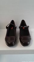 Front view of the pair of dark brown Aetrex ladies' shoes with buckle strap, size 8.5