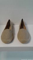 Front view of new Franco Sarto ladies shoes in size 8.5. Light beige woven fabric with jute sole.