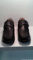 Front view of pair of men's black leather shoes with Velcro strap closure showing size 43W width and toe design.