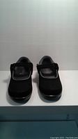 Front view of the pair of black Orthofeet ladies shoes with adjustable strap and mesh upper, size 8.5 wide.