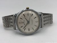 Front angle view of Belforte 17 jewel vintage wristwatch with stainless steel case and metal band.