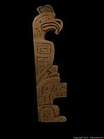 Front view of the vertical First Nations wooden plaque showing carved eagle head and body with traditional indigenous patterns