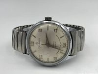 Front view of the Helbros wristwatch showing silver-tone dial with hour markers, brand name, and mechanical hands.