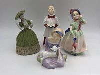 Front view of all four Royal Doulton figurine dolls showing details of clothes and poses.