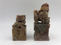 Two soap stone stamps with carved Chinese Foo Dogs on square bases, front view