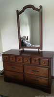 Front view of Vilas maple dresser with mirror attached, showing six drawers and wood finish.