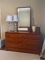 Front view of teak dresser with mirror on top