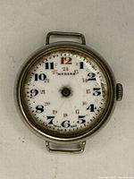 Close-up photo of the vintage Medana trench watch dial showing detailed numerals, brand name, and condition.