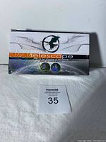 Front view of boxed telescope with eagle image and holographic design