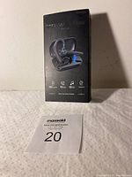 Front view of the product box showing brand name, image of the earbuds in charging case, key features.