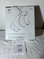 Back of box showing the headphone image, multiple control buttons, brand logo, and some product information.