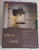 Boxed Allen + Roth Stonecroft wall lantern showing brand, series, dimensions, and clear glass shade