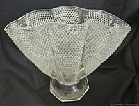 Front angle showing the fan shape and raised dewdrop texture with vertical panel divisions