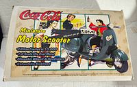 Box for Coca-Cola Miniature Motor Scooter showing limited edition and features.