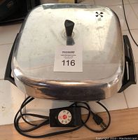 Square stainless steel electric fry pan with lid and temperature control cord and knob.
