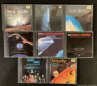 Eight CDs with original jewel cases, featuring soundtracks and classical music. Cover artwork visible for titles including Return of the Jedi, Star Tracks (Star Trek), E.T., and Holst's The Planets.