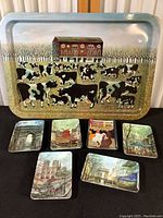 Full lot showing metal barnyard serving tray with cow theme alongside six plastic snack plates with Paris scenes