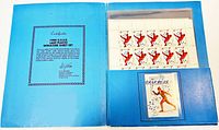 Blue presentation folder opened showing sheet of uncirculated 1980 USSR Olympic stamps and an insert with a single stamp of skater in red.