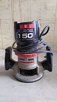 Front angle view of the Sears Craftsman 150 speed router showing the Craftsman logo, speed dial, and coiled power cord.